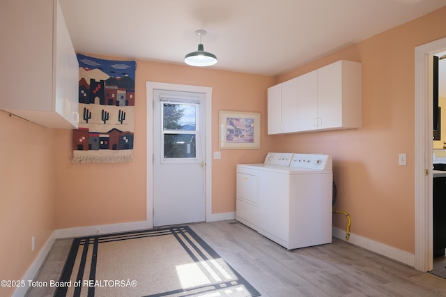 2697 Rendezvous Dr, Driggs, ID 83422 - laundry room featuring cabinet space, separate washer and dryer, baseboards, and light wood-type flooring