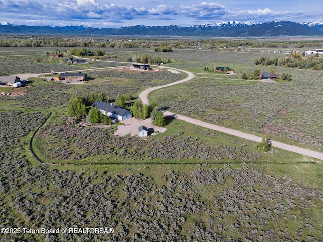 2697 Rendezvous Dr, Driggs, ID 83422 - aerial overview of property's location with rural landscape and a mountainous background