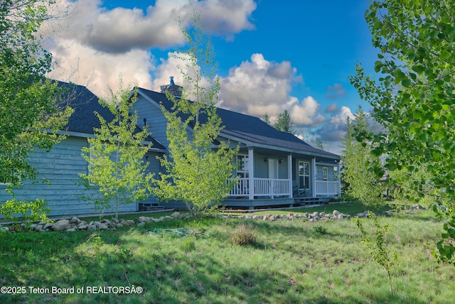 2697 Rendezvous Dr, Driggs, ID 83422 - view of property exterior featuring a porch and a lawn