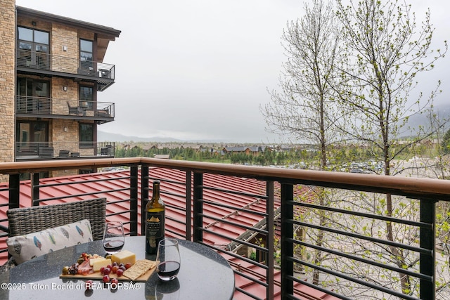3335 W Villlage Dr Unit 201/203, Teton Village, WY 83025 - balcony featuring outdoor dining space and a mountain view