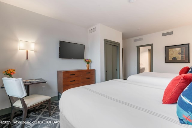 3335 W Villlage Dr Unit 201/203, Teton Village, WY 83025 - bedroom with baseboards and ensuite bathroom