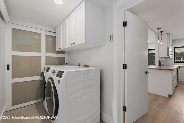 826 Powderhorn Ln Unit C, Jackson, WY 83001 - laundry area featuring cabinet space, washing machine and dryer, baseboards, recessed lighting, and light wood finished floors
