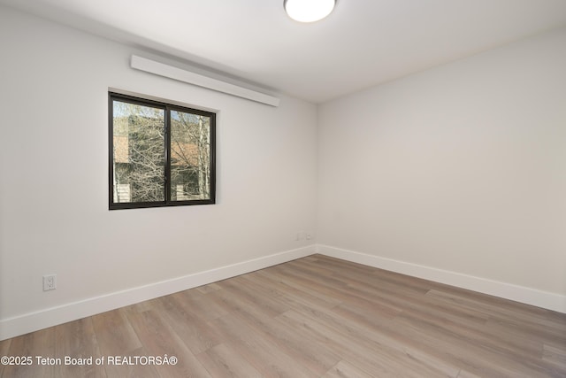 826 Powderhorn Ln Unit C, Jackson, WY 83001 - empty room featuring baseboards and light wood finished floors
