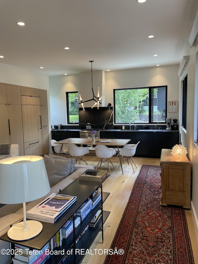 125 Pine Dr, Jackson, WY 83001 - dining space with plenty of natural light, recessed lighting, light wood-style floors, and a chandelier
