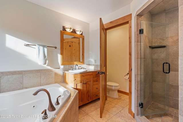19 Moulton Ln, Victor, ID 83422 - bathroom featuring a shower stall, a whirlpool tub, vanity, and toilet