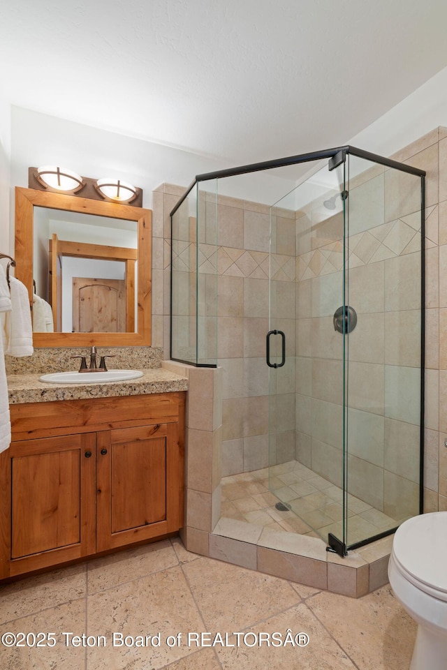 19 Moulton Ln, Victor, ID 83422 - full bathroom featuring vanity, a shower stall, and toilet