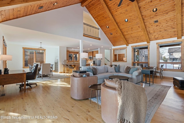 19 Moulton Ln, Victor, ID 83422 - living room with wooden ceiling with exposed beams, high vaulted ceiling, light wood-style floors, and recessed lighting