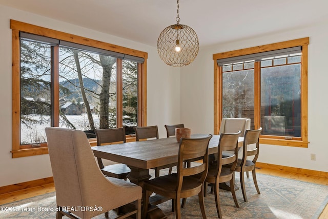 19 Moulton Ln, Victor, ID 83422 - dining area with light wood-style floors, baseboards, and a mountain view