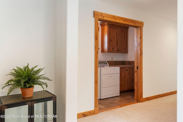 19 Moulton Ln, Victor, ID 83422 - laundry room with cabinet space, baseboards, separate washer and dryer, and carpet flooring