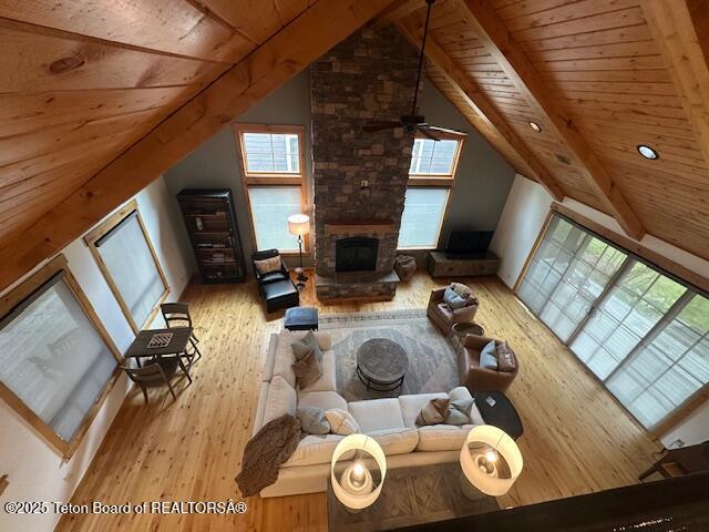 19 Moulton Ln, Victor, ID 83422 - living area with wooden ceiling, wood finished floors, plenty of natural light, and a fireplace
