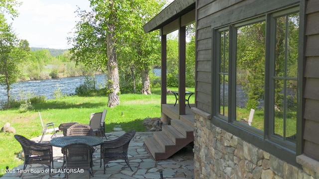4641 N River Hollow Dr, Ashton, ID 83420 - view of patio featuring a water view
