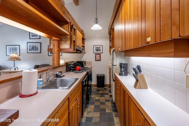 3665 N Teton Dr Unit 623, Wilson, WY 83014 - kitchen with a sink, brown cabinetry, light countertops, and backsplash
