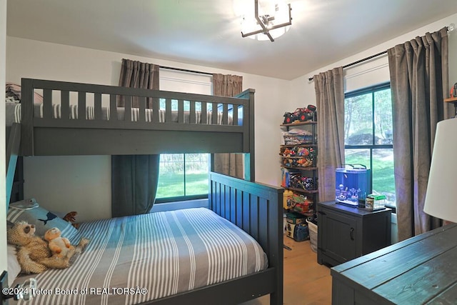 bedroom with wood finished floors