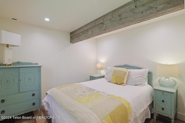 bedroom with dark wood-style floors, beamed ceiling, and recessed lighting