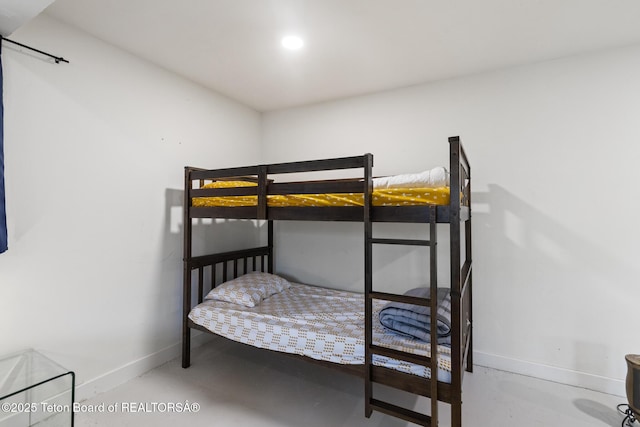 2077 Highland Way, Victor, ID 83455 - bedroom featuring baseboards and concrete floors