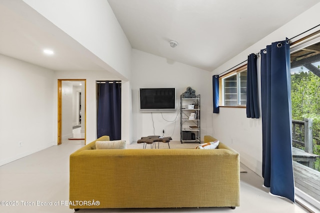 2077 Highland Way, Victor, ID 83455 - living room with vaulted ceiling, recessed lighting, and finished concrete flooring