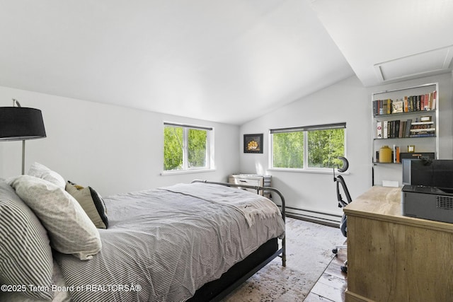 2077 Highland Way, Victor, ID 83455 - bedroom with lofted ceiling, light wood-style flooring, and a baseboard heating unit