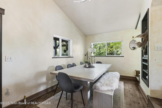 2077 Highland Way, Victor, ID 83455 - dining area with dark wood-type flooring and high vaulted ceiling