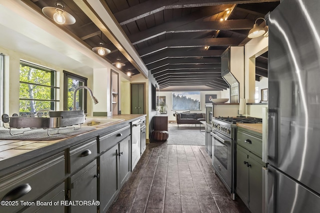 2077 Highland Way, Victor, ID 83455 - kitchen featuring stainless steel appliances, vaulted ceiling, wooden counters, and dark wood-style floors