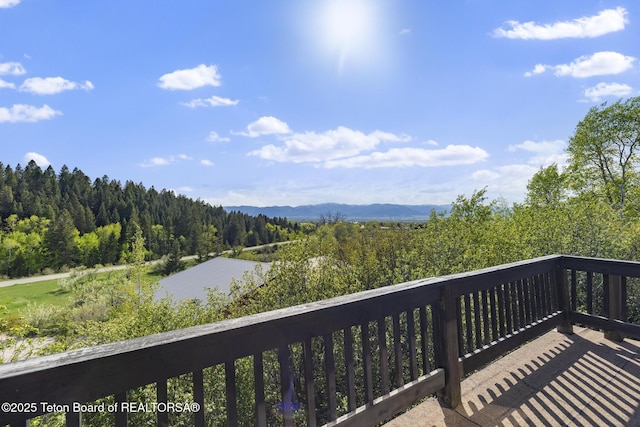 2077 Highland Way, Victor, ID 83455 - deck featuring a forest view and a mountain view