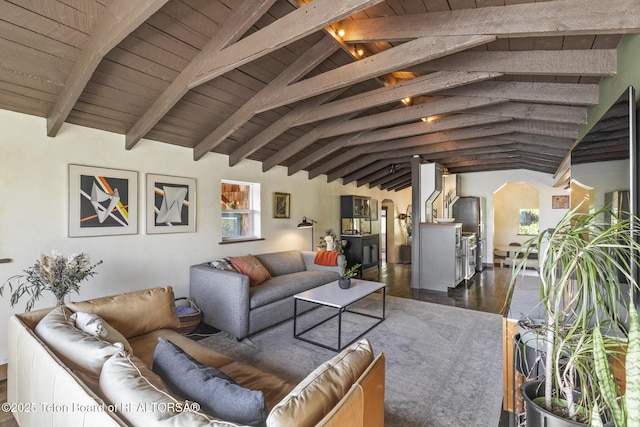 2077 Highland Way, Victor, ID 83455 - living room with arched walkways, wooden ceiling, and dark wood-style floors