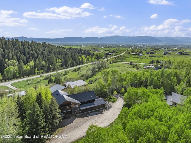 2077 Highland Way, Victor, ID 83455 - aerial view of property and surrounding area with a mountainous background and a forest