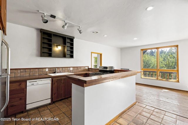2077 Highland Way, Victor, ID 83455 - kitchen with white dishwasher, stainless steel range oven, refrigerator, a peninsula, and recessed lighting