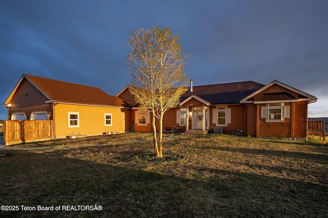 63 Iroquois Trl, Boulder, WY 82923 - ranch-style house with a front lawn, central AC unit, and a garage