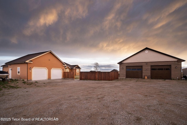 63 Iroquois Trl, Boulder, WY 82923 - property exterior at dusk with a detached garage