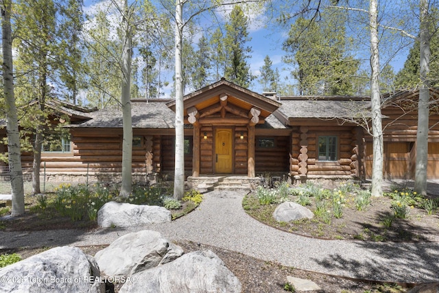 5725 W Caddis Fly Dr, Wilson, WY 83014 - log home with log siding and stone siding