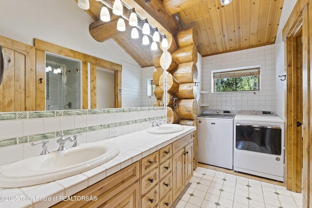 5725 W Caddis Fly Dr, Wilson, WY 83014 - full bathroom featuring independent washer and dryer, wooden ceiling, double vanity, a shower stall, and decorative backsplash