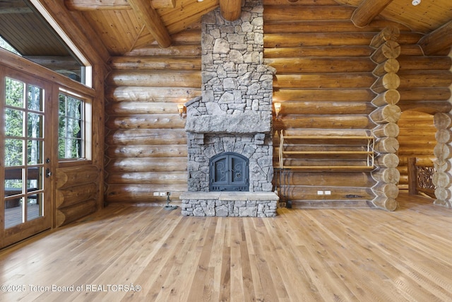 5725 W Caddis Fly Dr, Wilson, WY 83014 - unfurnished living room with wooden ceiling, hardwood / wood-style flooring, rustic walls, and a fireplace