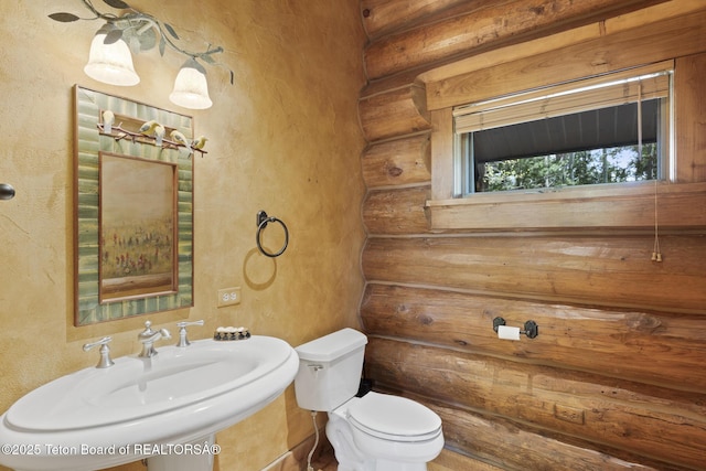 5725 W Caddis Fly Dr, Wilson, WY 83014 - bathroom featuring rustic walls and a textured wall