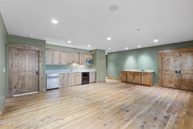 5725 W Caddis Fly Dr, Wilson, WY 83014 - kitchen with stainless steel appliances, light wood-type flooring, recessed lighting, and light countertops
