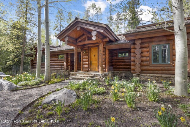 5725 W Caddis Fly Dr, Wilson, WY 83014 - view of front of home featuring log exterior