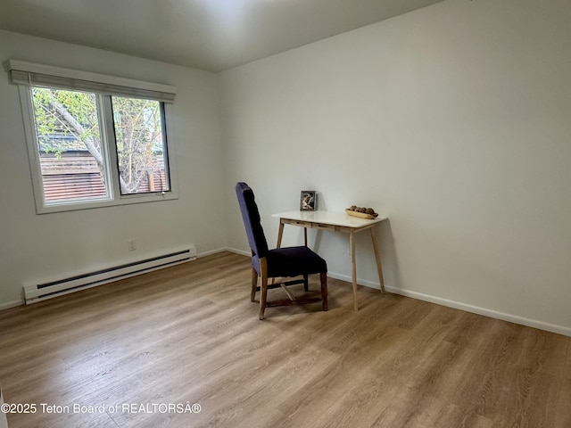 385 N Glenwood St, Jackson, WY 83001 - office featuring a baseboard radiator, light wood-type flooring, and baseboards