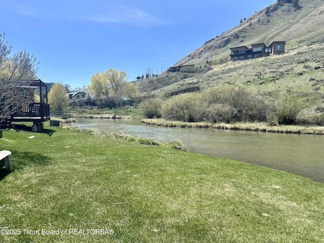 385 N Glenwood St, Jackson, WY 83001 - view of green lawn featuring a water and mountain view