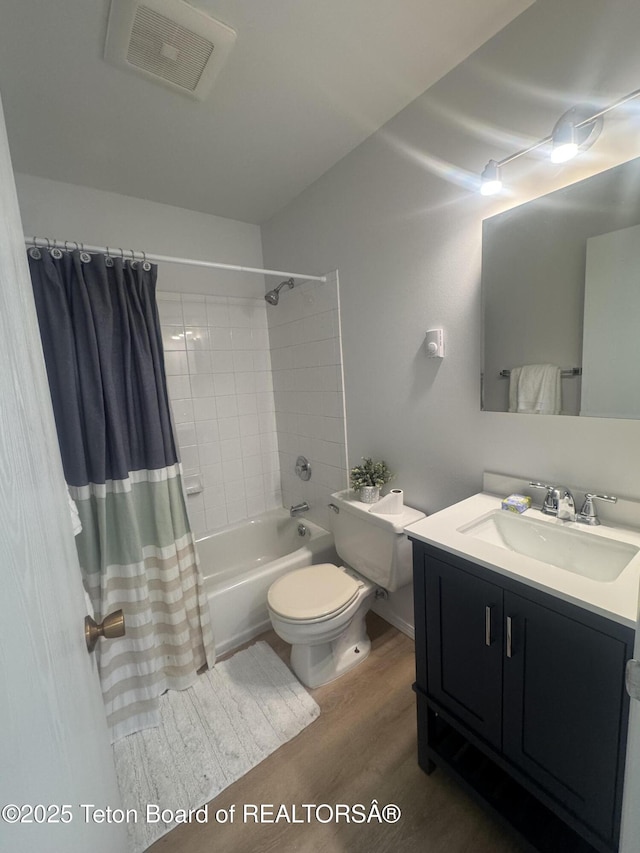 385 N Glenwood St, Jackson, WY 83001 - full bath with wood finished floors, toilet, vanity, and shower / bath combo
