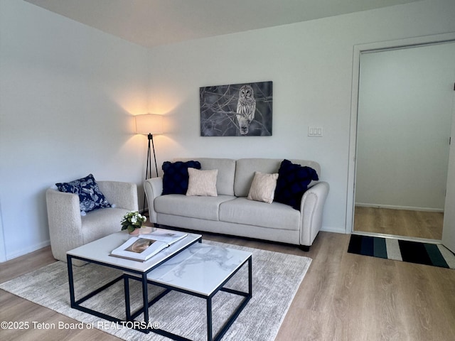385 N Glenwood St, Jackson, WY 83001 - living room with wood finished floors and baseboards