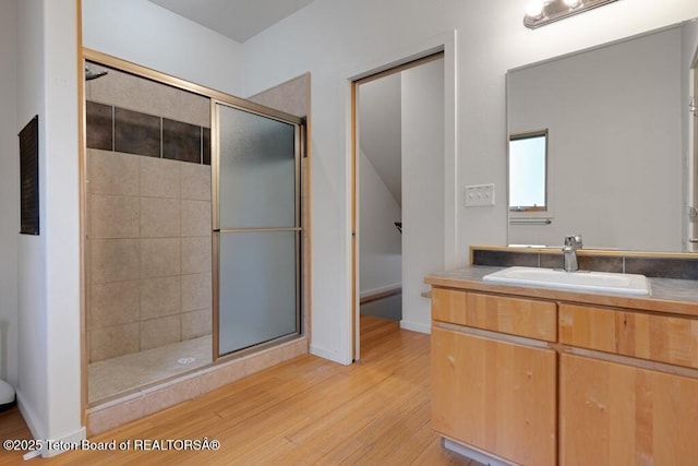668 S Millward St, Jackson, WY 83001 - bathroom featuring a shower stall, wood finished floors, and vanity