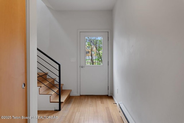 668 S Millward St, Jackson, WY 83001 - entryway with light wood-style flooring, stairs, baseboards, and baseboard heating