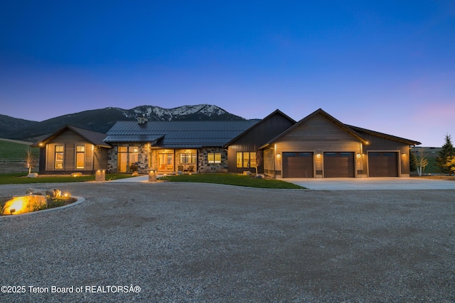 2399 Chapel Rd, Swan Valley, ID 83449 - view of front of property with concrete driveway, a garage, and a standing seam roof