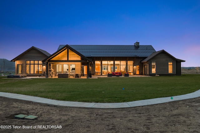 2399 Chapel Rd, Swan Valley, ID 83449 - back of house with an outdoor hangout area, a yard, a chimney, and a patio area