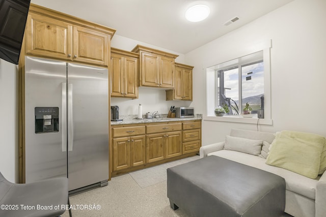 2399 Chapel Rd, Swan Valley, ID 83449 - kitchen with appliances with stainless steel finishes, open floor plan, a sink, and light stone countertops