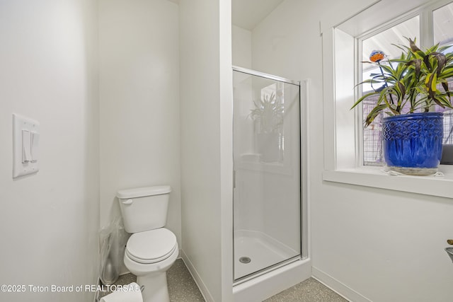 2399 Chapel Rd, Swan Valley, ID 83449 - bathroom featuring baseboards, a stall shower, and toilet