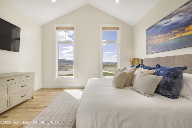 2399 Chapel Rd, Swan Valley, ID 83449 - bedroom featuring light wood-type flooring, recessed lighting, baseboards, and lofted ceiling