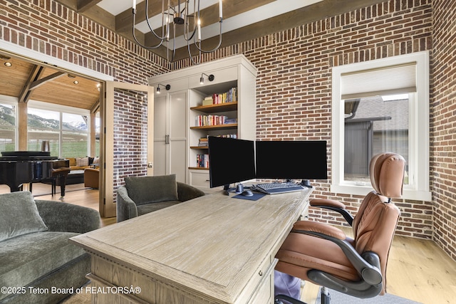 2399 Chapel Rd, Swan Valley, ID 83449 - office space with brick wall, wood finished floors, beam ceiling, a mountain view, and built in shelves