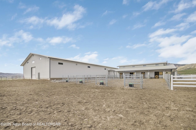 2399 Chapel Rd, Swan Valley, ID 83449 - rear view of property with an exterior structure and an outbuilding
