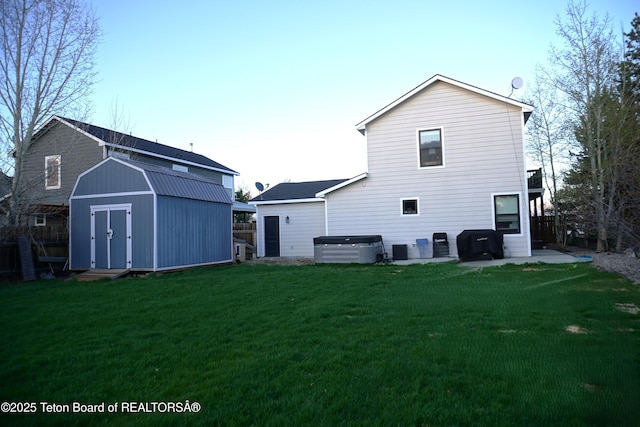 418 Par Ave, Pinedale, WY 82941 - rear view of house featuring a hot tub and cooling unit