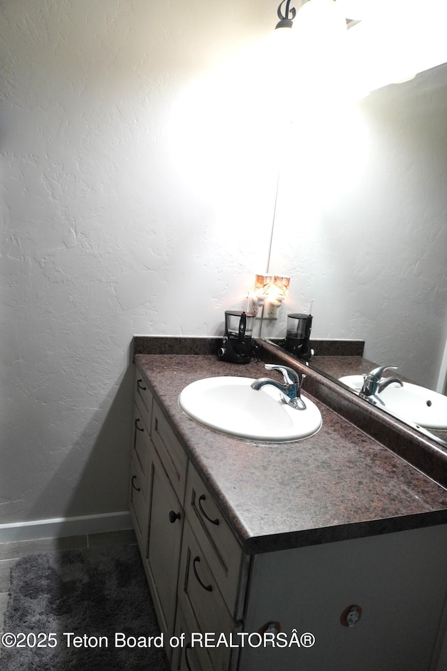418 Par Ave, Pinedale, WY 82941 - bathroom with vanity, baseboards, and a textured wall
